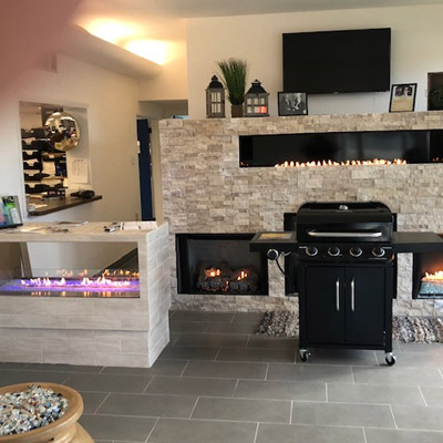 Thermotane Propane showroom with a grill and fireplaces