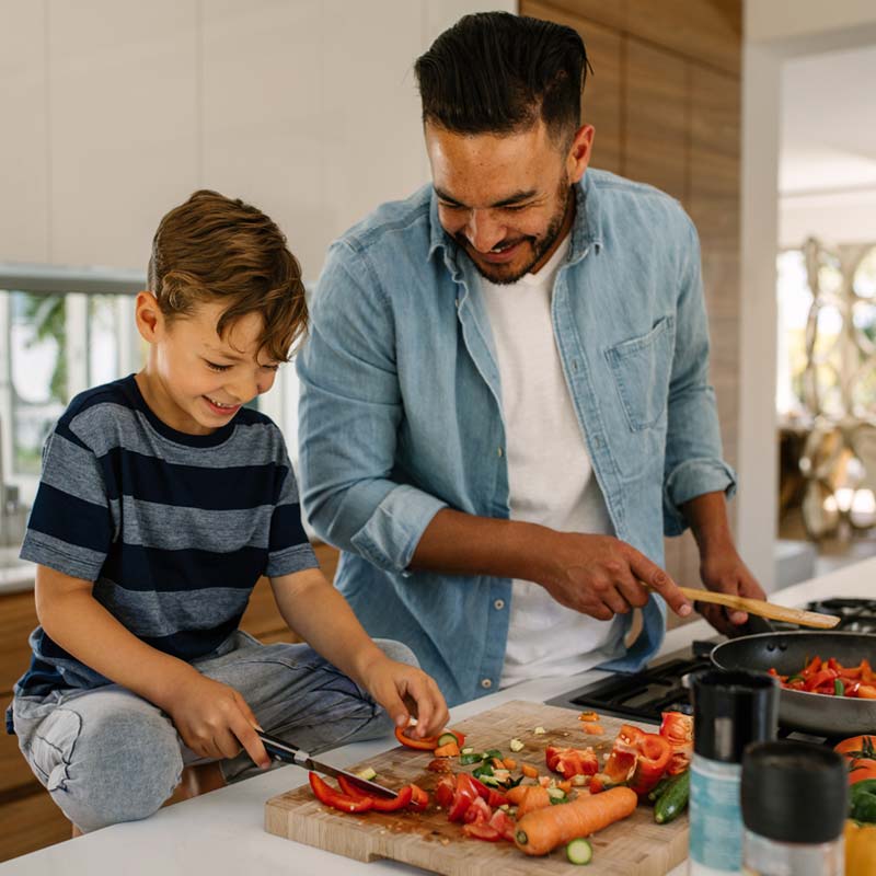 family-cooking Father cooking with his son