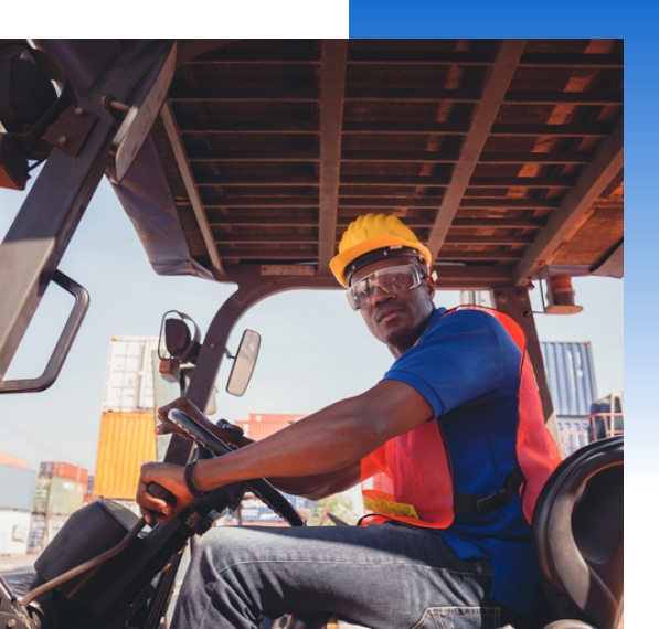 forklift-operator-looking-at-camera A person driving a forklift