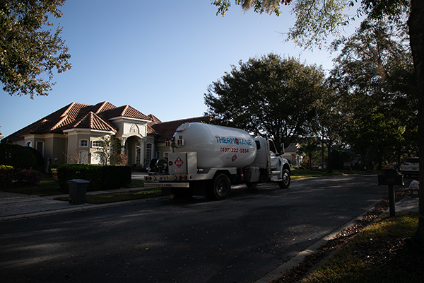 Thermotane propane truck on front of house