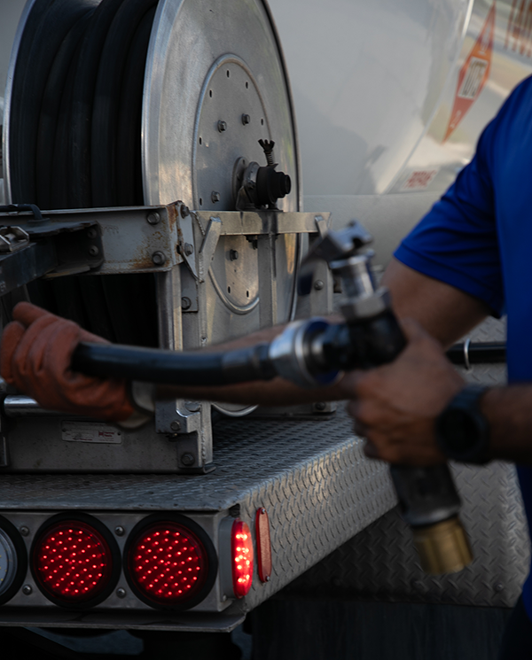 Thermotane employee wirking with propane hose